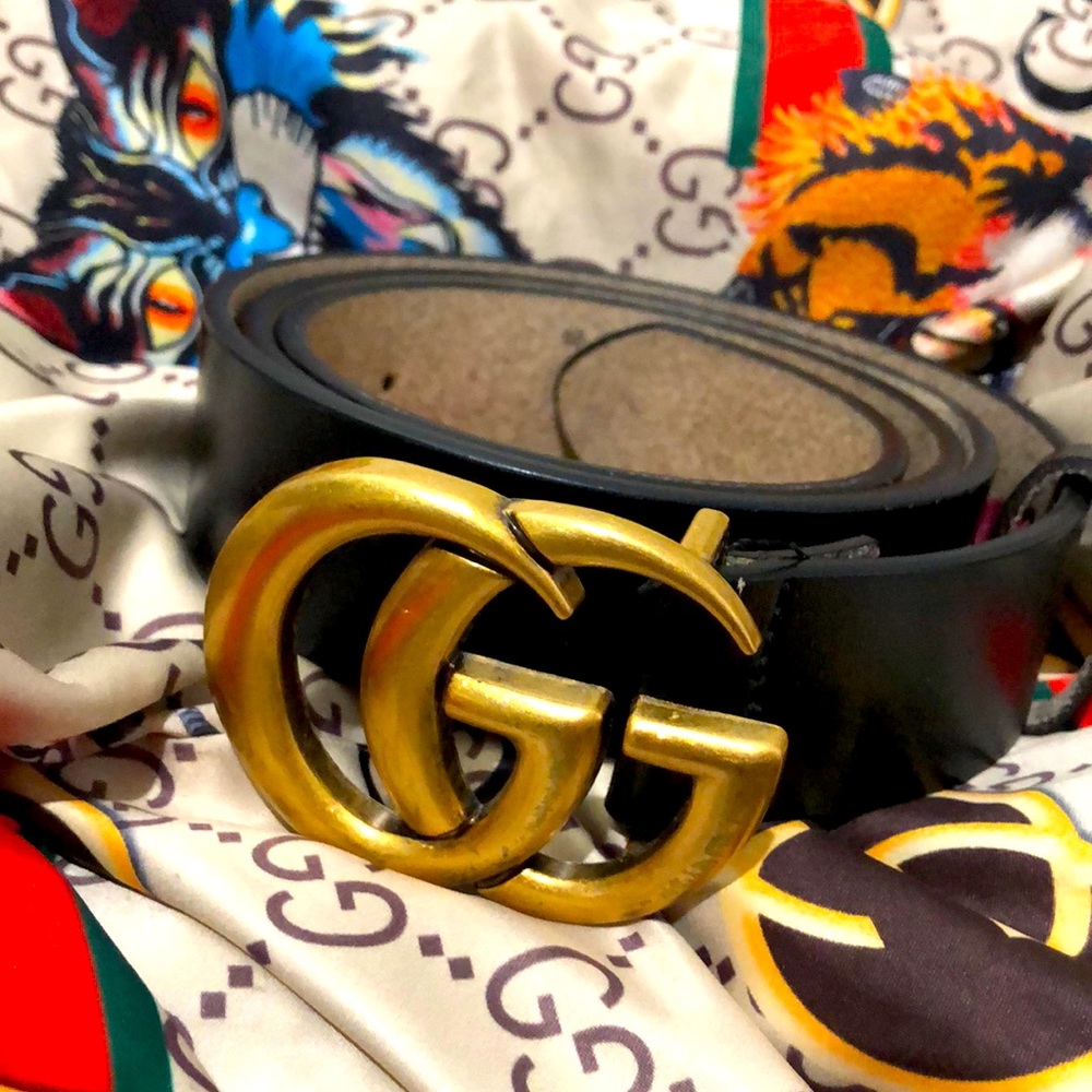 All black Gucci belt with gold buckle